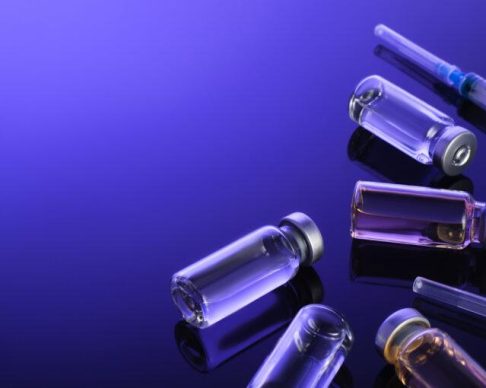 Syringes,,Small,Bottles,,Glass,Vials,With,Vaccine,,Medicine,On,A