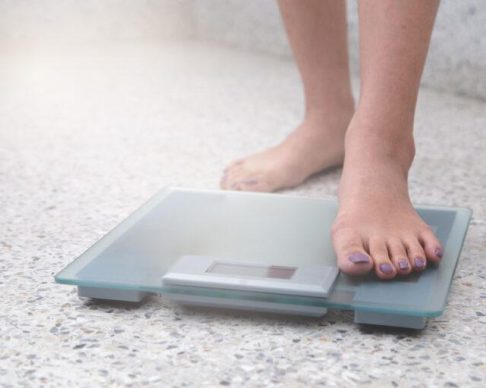 Woman,Was,Weighing,By,Using,Digital,Scale,,Diet,Concept